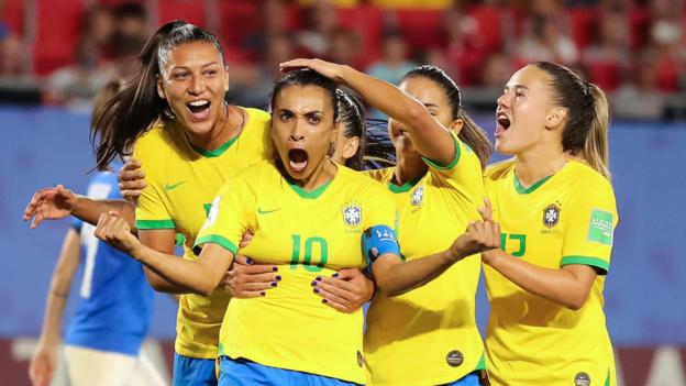 Marta becomes the all-time World Cup top scorer with a goal that helps Brazil beat Italy in their final group game of the 2019 tournament.