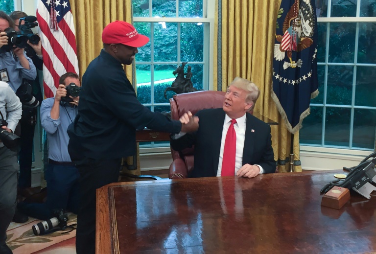 Analysts are reluctant to write off Kanye West, pictured in 2018 meeting President Donald Trump, whose run in 2016 wasn't considered serious until he won the Republican nomination -- and say the rapper doesn't have to win the race to influence it