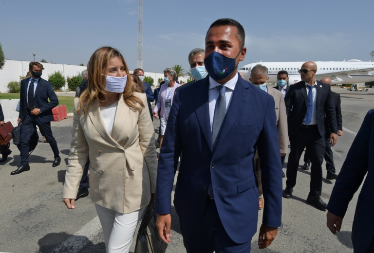 Italian Foreign Minister Luigi Di Maio (R) is welcomed on his arrival in Tunis by Tunisian Secretary of State for Foreign Affairs Salma Ennaiefer